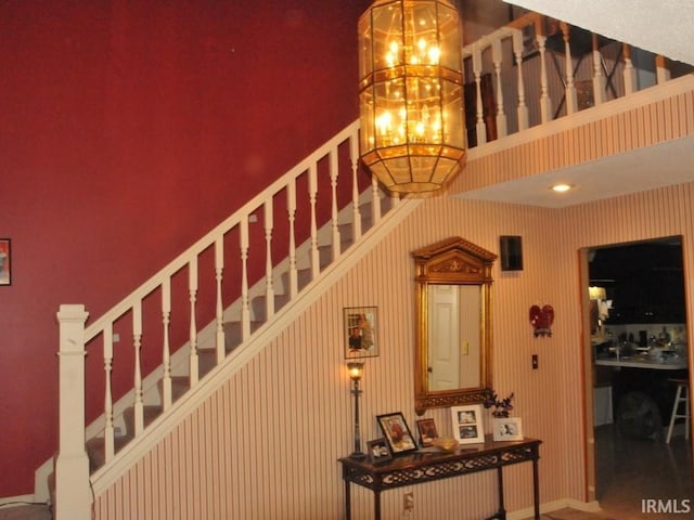 stairway with a towering ceiling