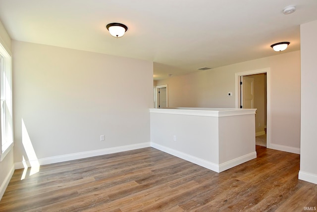 empty room featuring hardwood / wood-style flooring
