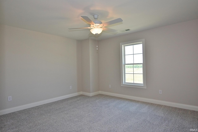 unfurnished room featuring ceiling fan and light carpet