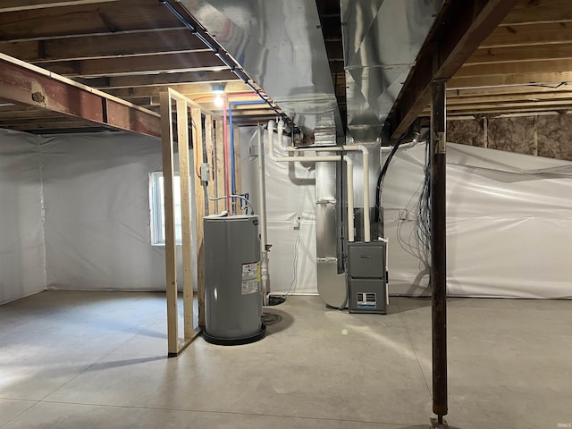 basement featuring electric water heater and heating unit