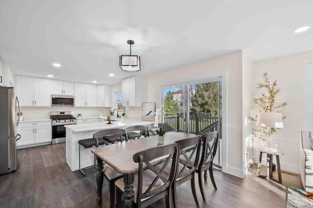 1114 Beacon Dr, Mishawaka, IN 46544 - dining area with recessed lighting, dark wood-type flooring, and baseboards