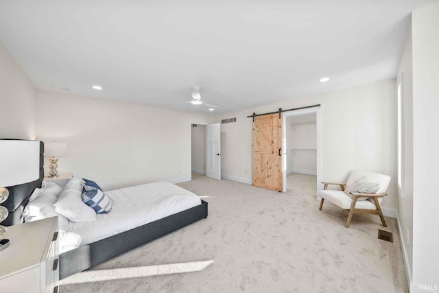 1114 Beacon Dr, Mishawaka, IN 46544 - bedroom with visible vents, light colored carpet, a barn door, and baseboards
