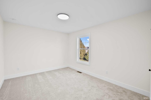 1114 Beacon Dr, Mishawaka, IN 46544 - carpeted spare room with baseboards and visible vents