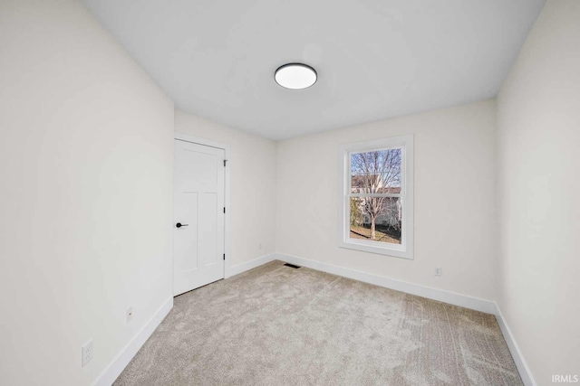 1114 Beacon Dr, Mishawaka, IN 46544 - carpeted empty room featuring visible vents and baseboards