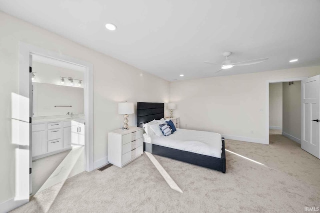1114 Beacon Dr, Mishawaka, IN 46544 - bedroom with visible vents, baseboards, ensuite bathroom, recessed lighting, and light carpet