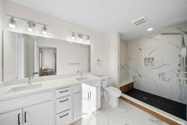 1114 Beacon Dr, Mishawaka, IN 46544 - bathroom featuring double vanity, toilet, a marble finish shower, visible vents, and a sink
