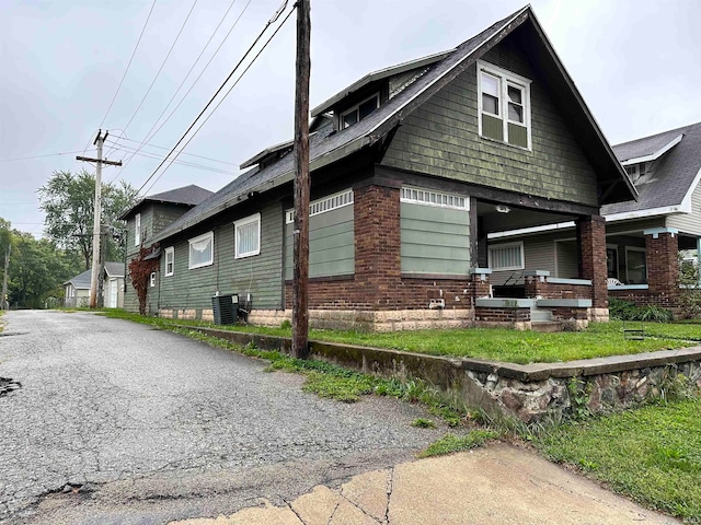 view of property exterior with central AC