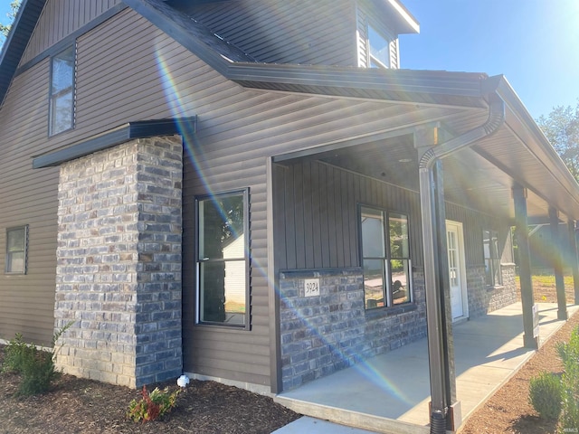 view of side of home with a patio