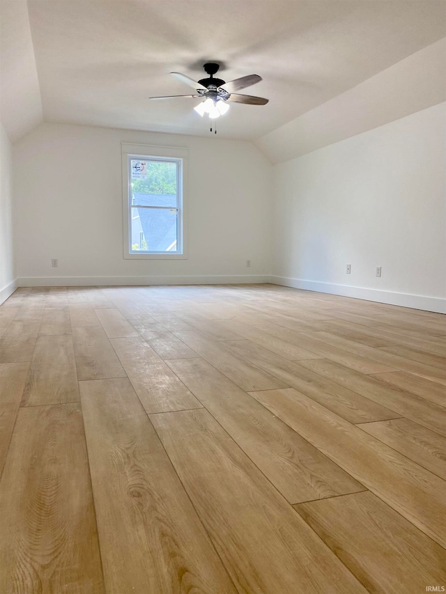 interior space with ceiling fan, light wood-type flooring, and lofted ceiling