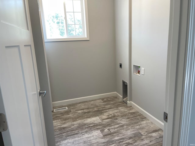 washroom featuring washer hookup, dark hardwood / wood-style floors, and hookup for an electric dryer