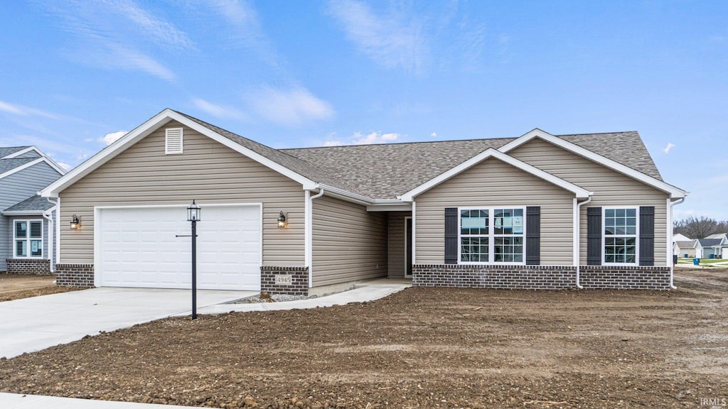 4945 Cultivator Ct, Fort Wayne, IN 46818 - ranch-style house with a garage