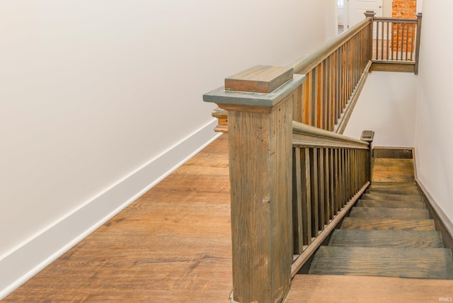 stairs with wood-type flooring