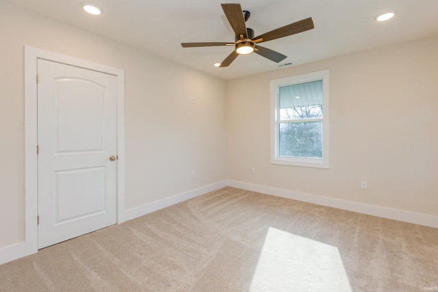 empty room with carpet floors and ceiling fan