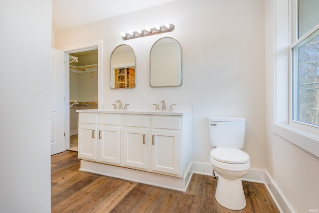 bathroom with vanity, hardwood / wood-style floors, and toilet