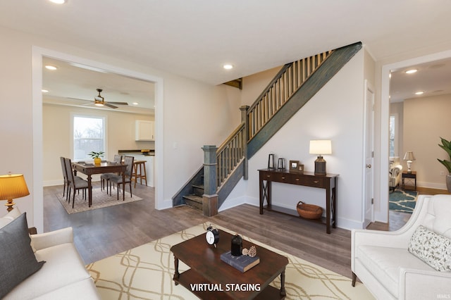 living room featuring ceiling fan and hardwood / wood-style floors