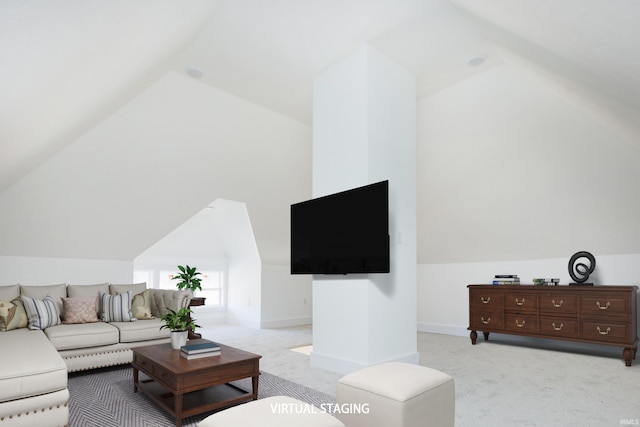 living room featuring lofted ceiling and light carpet