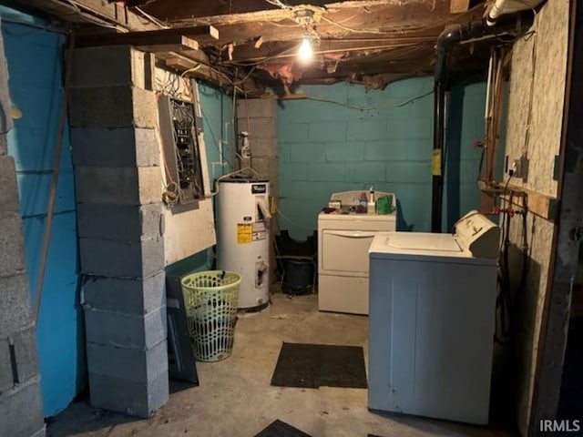 basement featuring independent washer and dryer and water heater