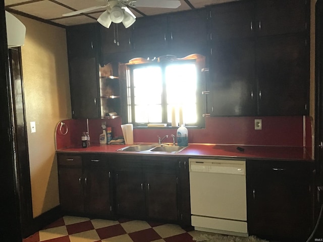 kitchen featuring ceiling fan, sink, and white dishwasher