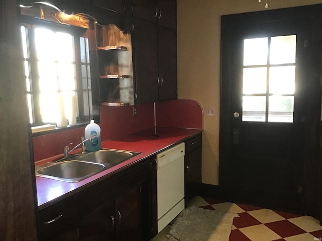 kitchen with white dishwasher, a wealth of natural light, and sink