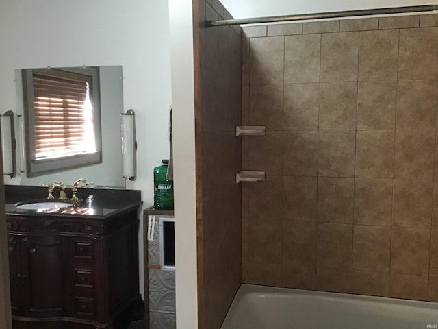 bathroom with vanity and tiled shower / bath combo