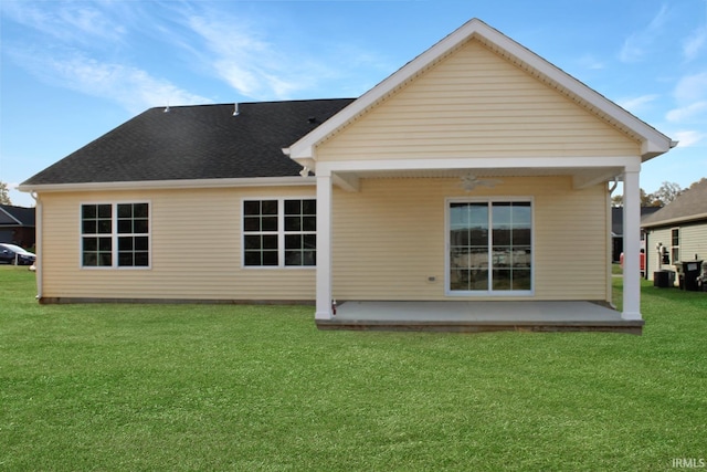 back of property featuring a yard and a patio