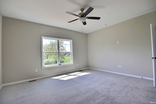 carpeted empty room with ceiling fan