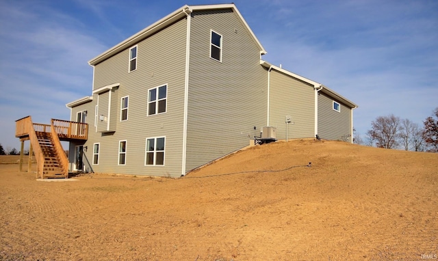 1282 Stintson Dr, Huntington, IN 46750 - view of property exterior with cooling unit, a wooden deck, and stairs