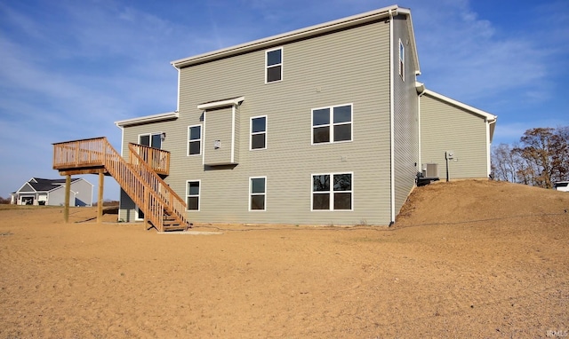 1282 Stintson Dr, Huntington, IN 46750 - back of house featuring a wooden deck and stairs