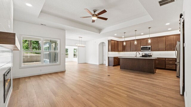 002 Ln 520 Lake James Unit 2, Fremont, IN 46737 - kitchen featuring open floor plan, ceiling fan, visible vents, and a raised ceiling