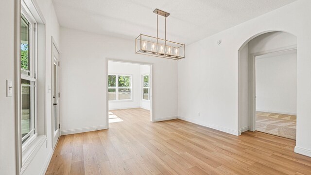 002 Ln 520 Lake James Unit 2, Fremont, IN 46737 - spare room with arched walkways, baseboards, and light wood-type flooring