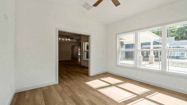 002 Ln 520 Lake James Unit 2, Fremont, IN 46737 - spare room with a ceiling fan, light wood-type flooring, baseboards, visible vents, and arched walkways