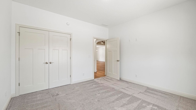 002 Ln 520 Lake James Unit 2, Fremont, IN 46737 - unfurnished bedroom featuring a closet, carpet, baseboards, and visible vents