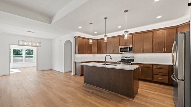 002 Ln 520 Lake James Unit 2, Fremont, IN 46737 - kitchen with backsplash, a sink, stainless steel appliances, and light wood-style floors