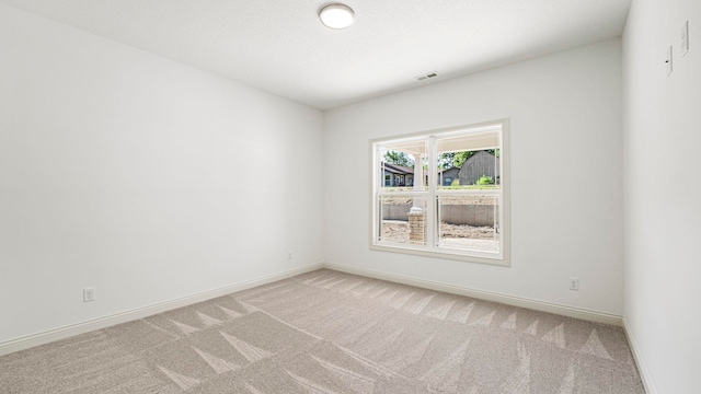 002 Ln 520 Lake James Unit 2, Fremont, IN 46737 - spare room featuring light carpet, baseboards, and visible vents