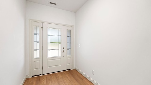 002 Ln 520 Lake James Unit 2, Fremont, IN 46737 - doorway with baseboards, light wood finished floors, and visible vents