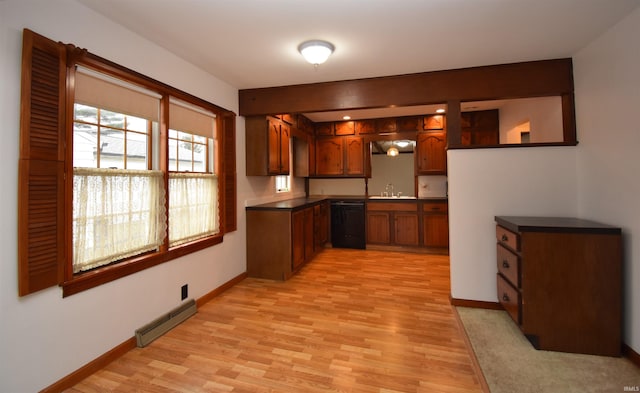 kitchen featuring light wood-type flooring, dishwasher, and sink