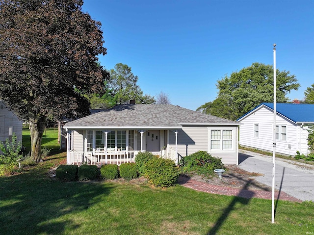 view of front of house with a front lawn and a porch