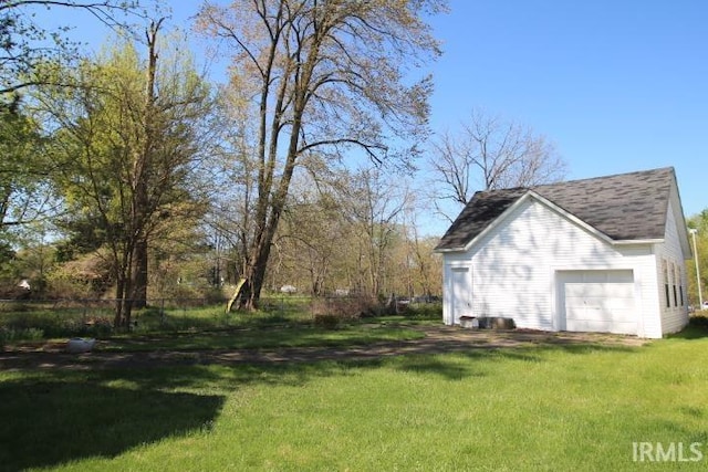 view of yard featuring a garage