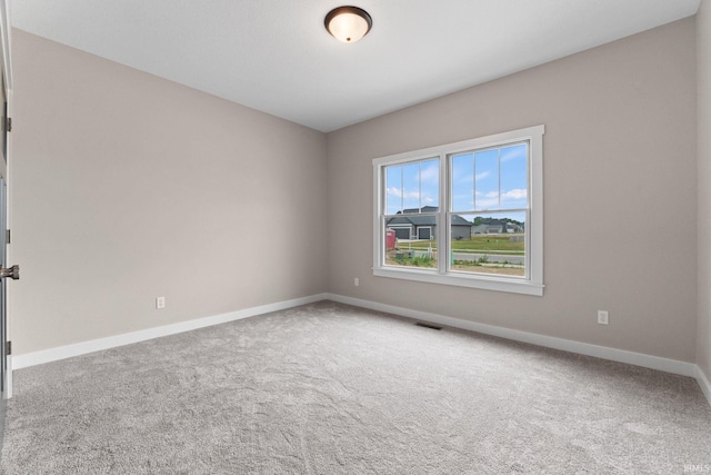 unfurnished room featuring carpet floors