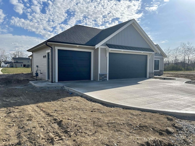 view of side of property with a garage