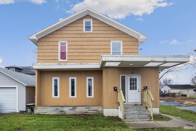 view of front of house featuring a front yard and a garage