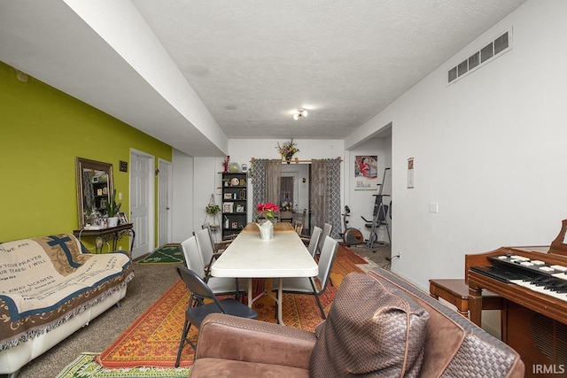 carpeted living room with a textured ceiling