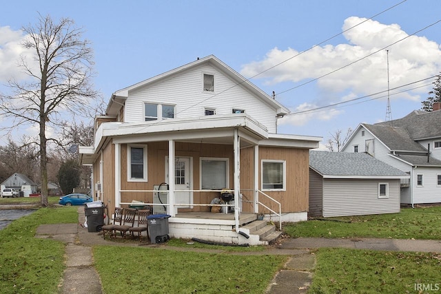 view of front of house featuring a porch and a front yard