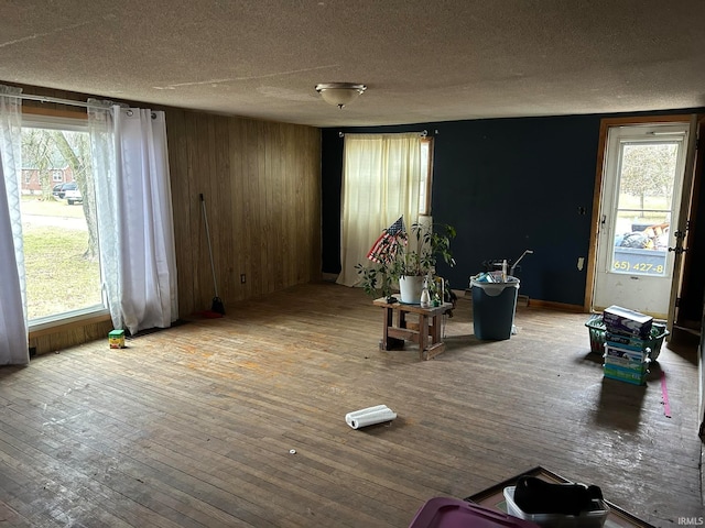 interior space featuring a wealth of natural light, hardwood / wood-style floors, and a textured ceiling