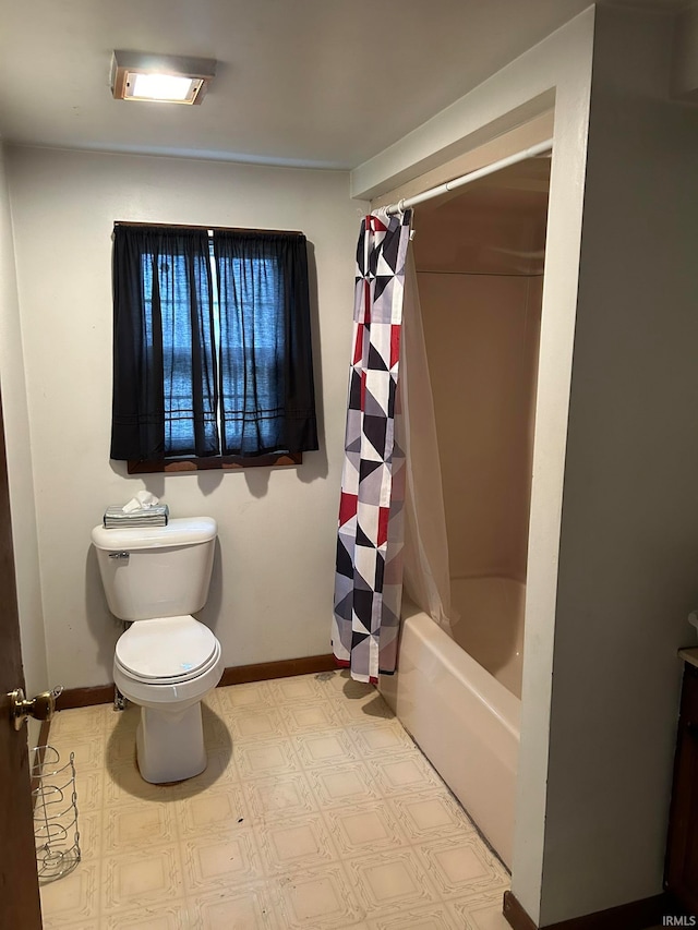 bathroom with tile flooring, shower / bath combination with curtain, and toilet