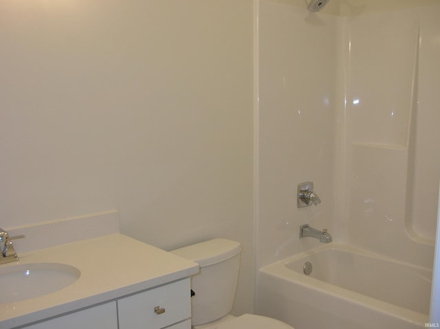 full bathroom with vanity, toilet, and washtub / shower combination