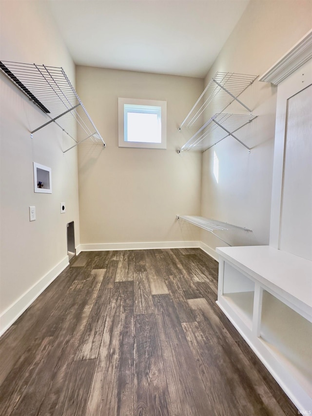 washroom featuring hookup for a washing machine, hookup for an electric dryer, and hardwood / wood-style flooring