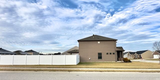 view of property exterior with a yard