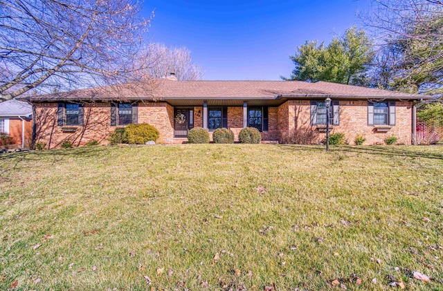 single story home featuring a front lawn