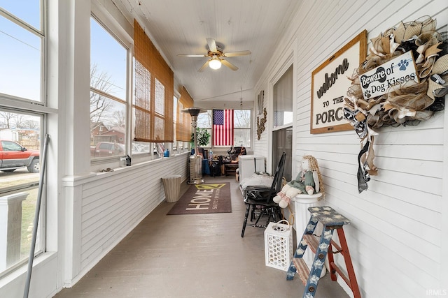 sunroom / solarium with vaulted ceiling and ceiling fan